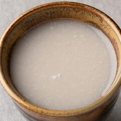  Cup of Japanese kuro Amazake, fermented rice drink close up