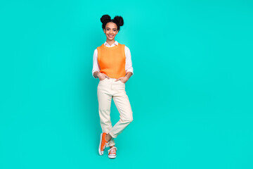 Full size photo of nice young girl posing empty space wear vest isolated on teal color background
