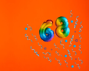Confetti explosion with number 68 balloon - Celebration on orange background. Birthday card