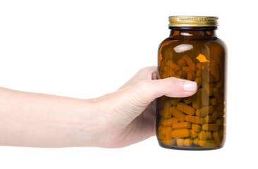 Glass jar of pills medicine health in hand on white background isolation