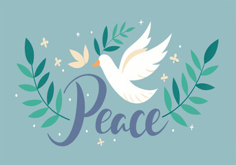 Naklejka premium A white dove is perched on a leafy branch