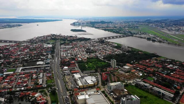 Panoramic aerial view of Samborondon connected by two bridges with Guayaquil in the background 2.7K