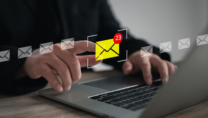 A businessman interacts with a virtual interface on a laptop, managing emails, checklists, ideas,...
