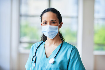 Confident Doctor in Hospital Setting Wearing Face Mask and Stethoscope