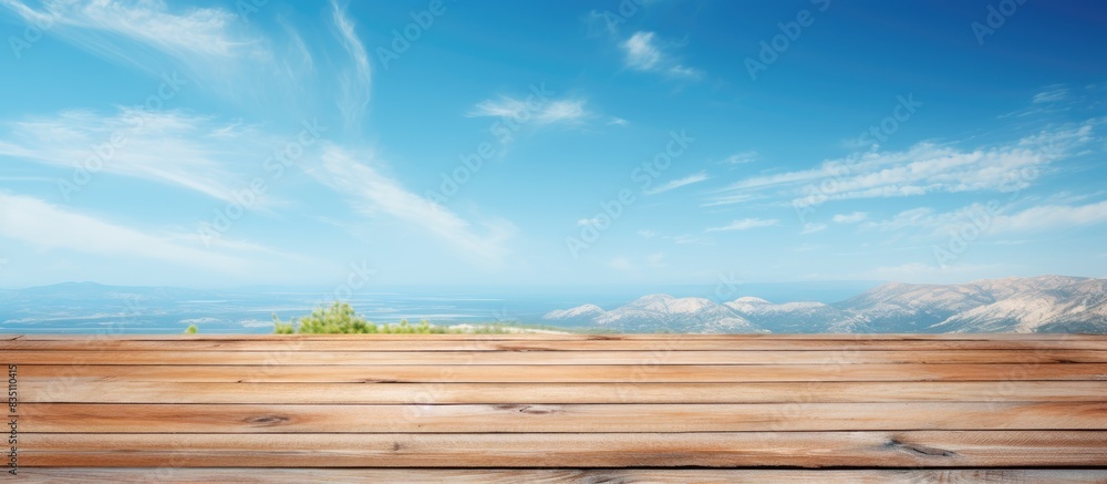 Aufkleber A wooden table surface set against a clear blue sky in summer provides a compelling backdrop for showcasing or arranging your items in a copy space image.