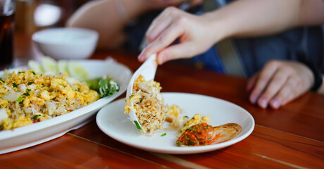 hand scoop crab fried rice on  plate