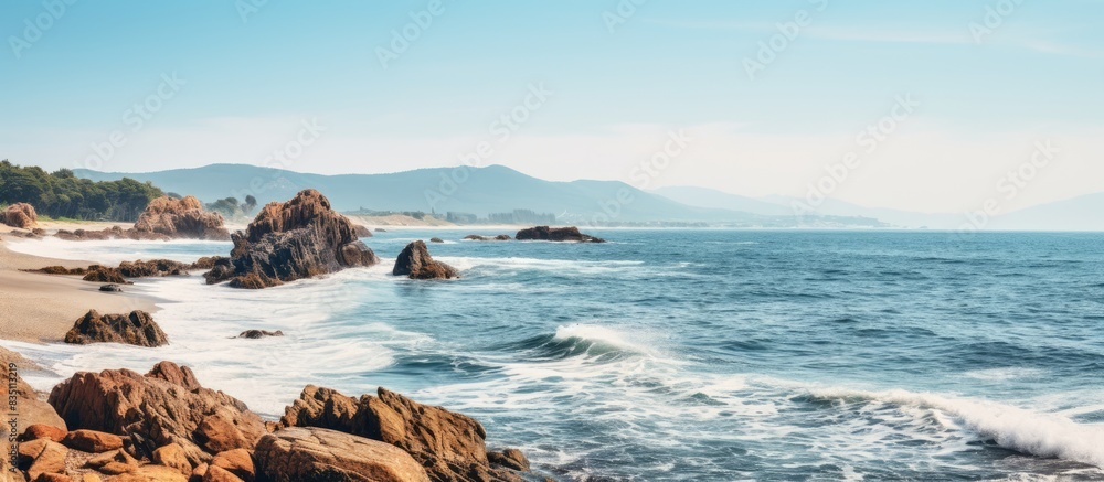 Poster Beautiful coastal rocks by the beach with a captivating view and copy space image.