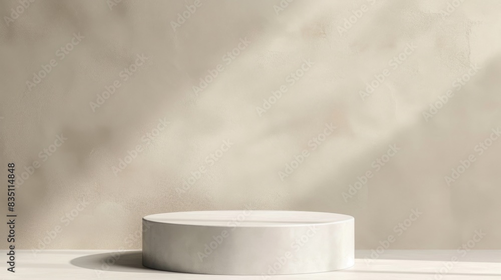 Poster Round minimalist display stand illuminated by soft natural light, casting subtle shadows on a plain neutral background.