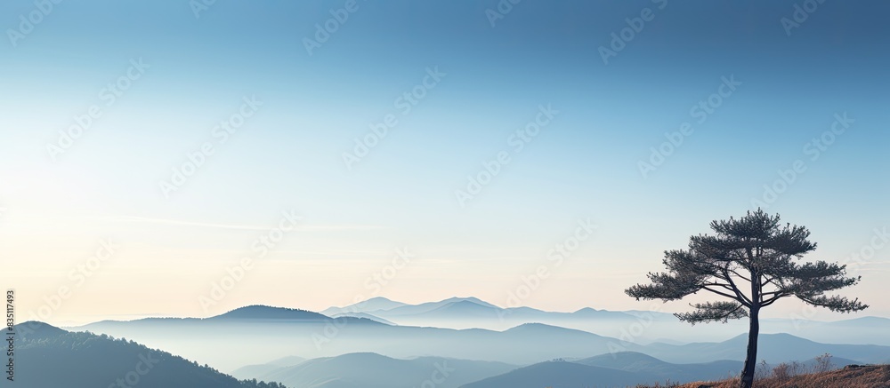 Poster Scenic mountain range with a clear sky providing ample copy space image.