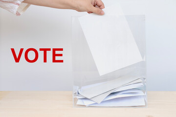 female hand voter with election ballot paper in polling station, voting rights, , election day,...