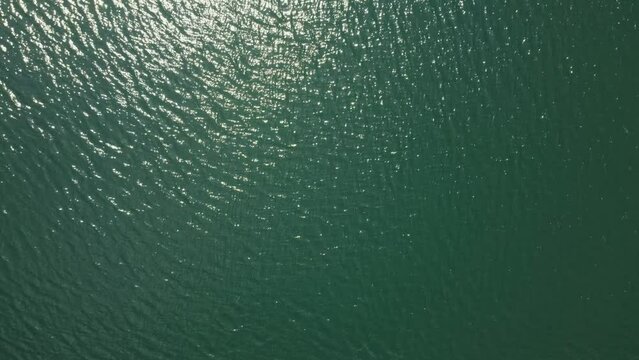 Top-down aerial view of lake water, drone shot directly from above