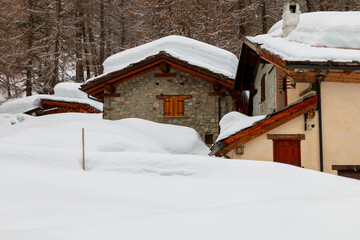 small mountain village covered in snow