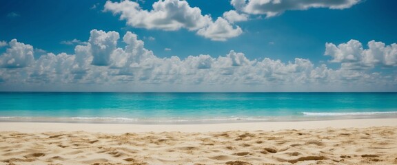Obraz premium Beautiful natural panoramic seascape with golden sandy beach, turquoise sea and blue sky with clouds on a bright sunny summer day.