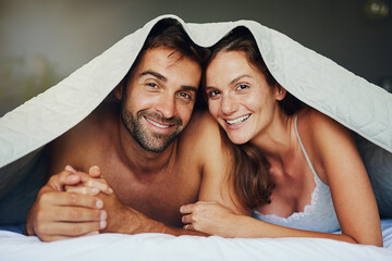 Happy couple, portrait and relax with bed sheets for love, bonding or awake from morning together...