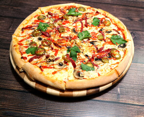 Hearty and flavorful pizza on a wooden background