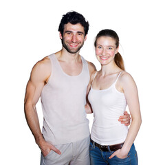 A smiling couple poses together in casual tank tops indoors, looking happy