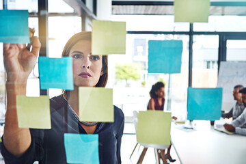Thinking, writing and business woman planning presentation in office for schedule, goal or team...