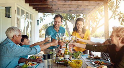 Food, love and big family with champagne toast on a patio for event, party or birthday celebration....