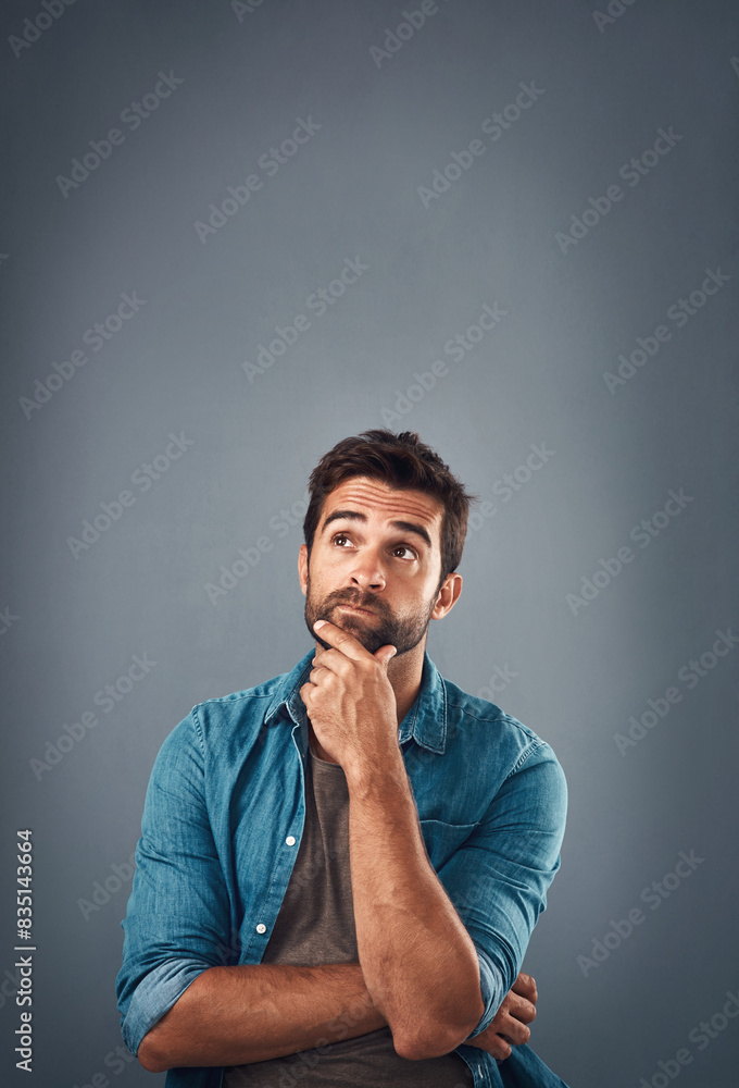 Aufkleber Portrait, thinking and man with ideas, solution and problem solving on grey studio background. Face, person and model with questions, mockup space and opportunity with choice, decision and remember