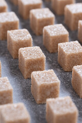 Straight rows of cane sugar cubes. Effect of dynamics.