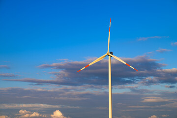 Wind turbine catching the last rays of sunset