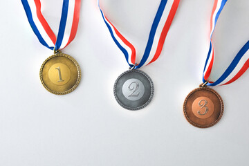 Set of medals with engraved numbers on white background