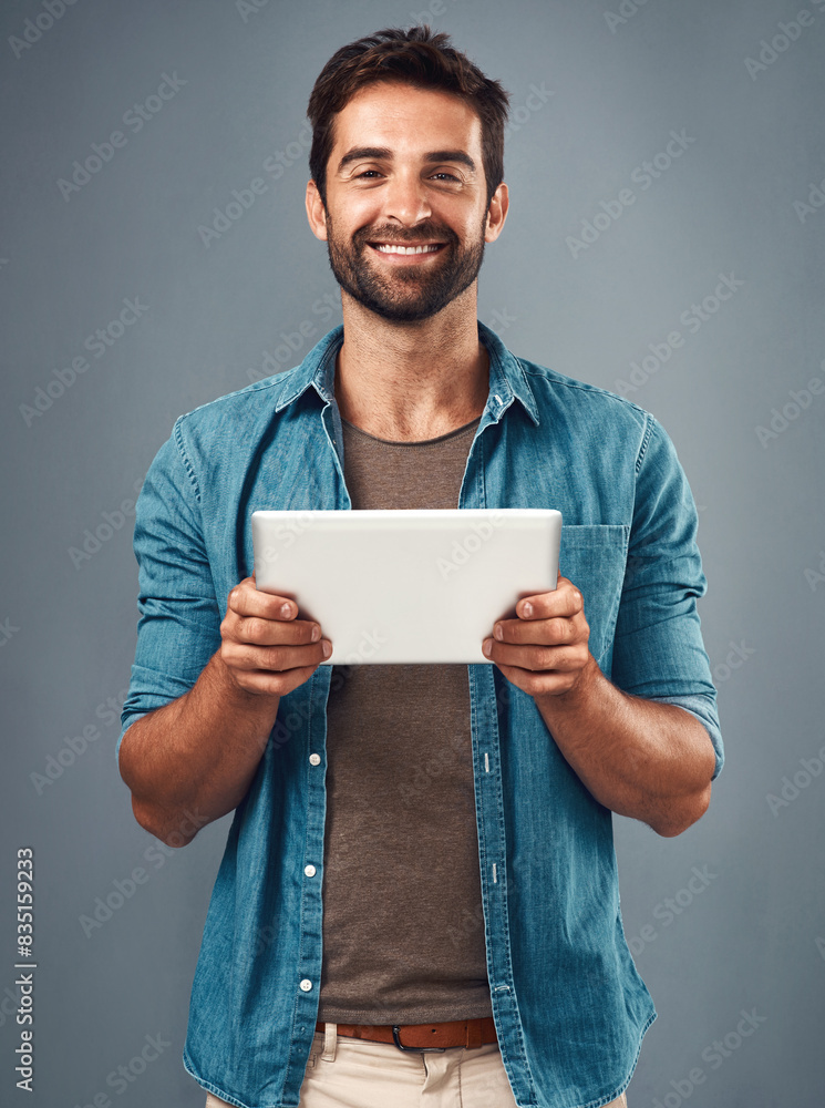 Aufkleber Man, studio and portrait with tablet and smile, career with software programming in London. Male creative, ebook and gray background with happiness for digital job, mobile app or website development