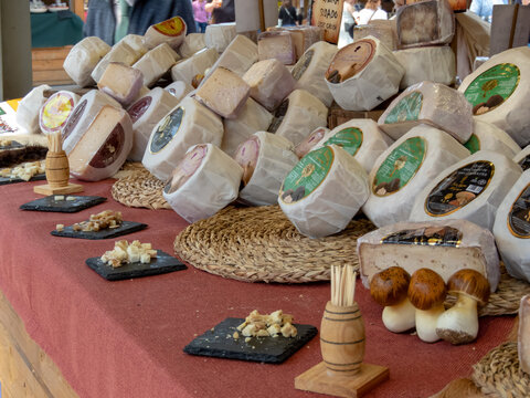 OVIEDO, SPAIN - MAY 10, 2024: Cheese abundance on the Fair of Ascension Day in Oviedo,Asturias,Spain.