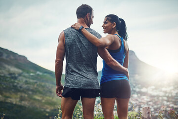 Fitness, couple and hug on mountain for outdoor marathon, running and training as team. Wellness,...