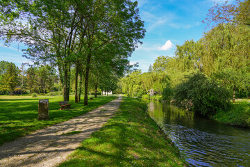 Footpath along the Fusain river in the Parc de la Tabarderie in Château-Landon, a rural village of the Gâtinais in the French department of Seine-et-Marne, Paris Region, France