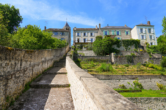 Stairway leading uphill to the church of Our Lady of the Assumption in Ch&acirc;teau-Landon, a rural village of the G&acirc;tinais in Seine et Marne, Paris Region, France