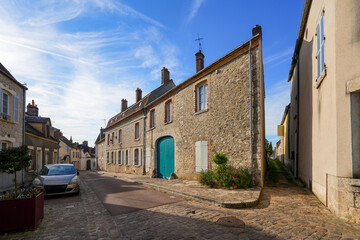 Cobbled street in the historic center of the village of Ferrière-en-Gâtinais in the French department of Loiret, Centre Val de Loire, France