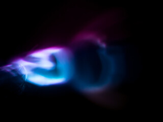 Light reflections in dark pink and blue for a magical abstract background.   