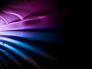 Fototapeta premium Light reflections in dark pink and blue for a magical abstract background. 