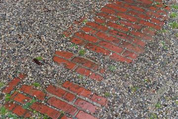 cobblestone path and pea gravel on a rainy and wet day
