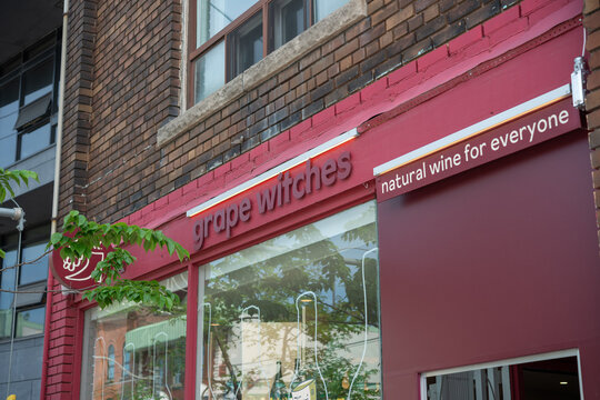 exterior and sign of Grape Witches, a wine store, located at 1247 Dundas Street West in Toronto, Canada