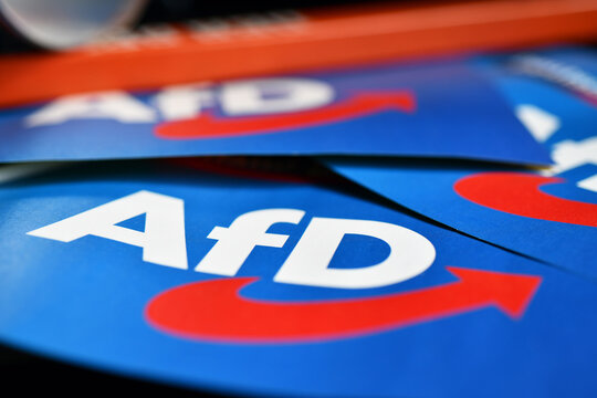 Burgdorf, Lower Saxony, Germany - April 24, 2024: Paper flag with the logo of  the right-wing political party Alternative for Germany, AfD