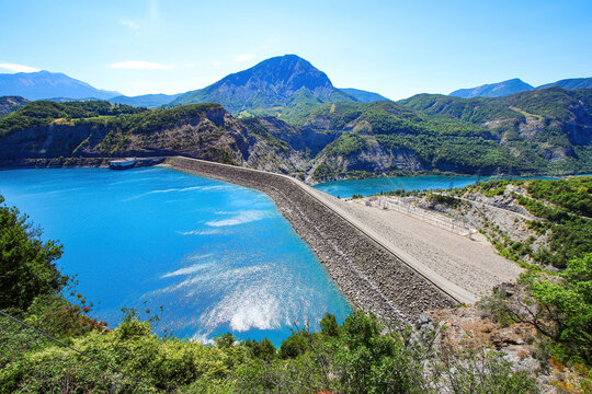 Aerial view of the Dam of Serre-Pon&ccedil;on, an embankment dam made of compacted soil built on the Durance river in the French Alps