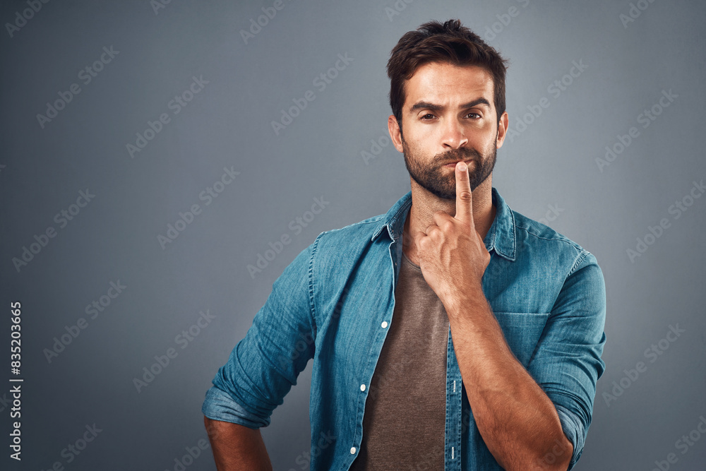 Poster Portrait, thinking and man with doubt, decision and problem solving on grey studio background. Face, person and model with questions, mockup space and opportunity with choice, confused and frustrated