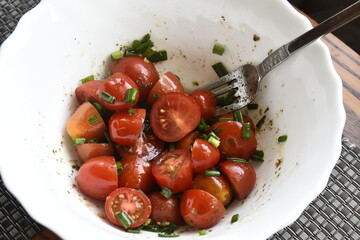 Chopped cherry tomatoes in a bowl