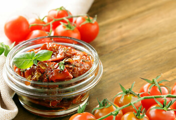 traditional Italian sun-dried tomatoes in oil with basil
