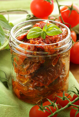 traditional Italian sun-dried tomatoes in oil with basil