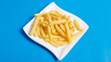 French fries on plate isolated