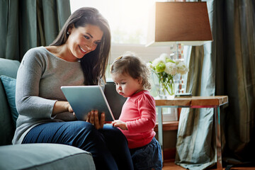 Education, mother and child with tablet in living room together for internet connection and development in home. Woman, kid or daughter with tech on couch for online learning and studying with love