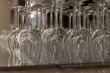 upside down set of wine glasses on a bar counter