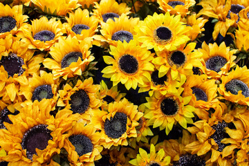 Fototapeta premium Artificial sunflowers in closeup as home decor