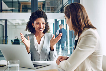 Business, discussion and women at laptop together for ideas, teamwork and partnership with...