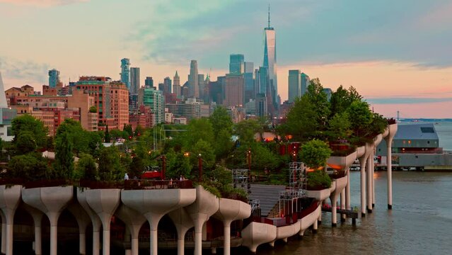 View of Lower Manhattan skyline at dusk, behind the Little Island public park.