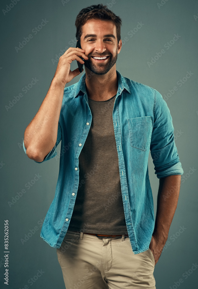 Poster phone call, smile and portrait of man in studio, cellphone and communication on gray background. int