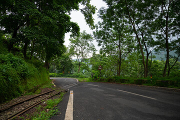 Toy train line, narrow gauge train line passing through Himalayan jungle. Darjeeling Himalayan Railway, narrow gauge railway between New Jalpaiguri and Darjeeling.